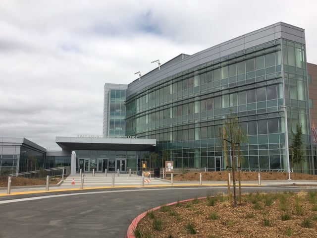 Exterior view of courthouse building showing the main entrance.