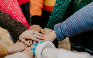 Hands coming together to work collaboratively