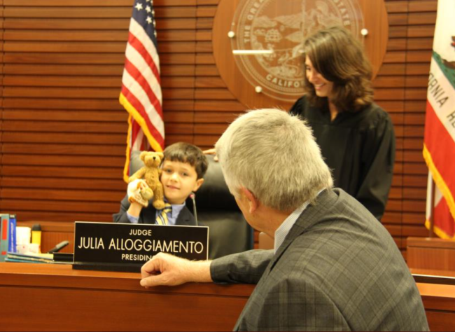 Image of adoptive child at the bench